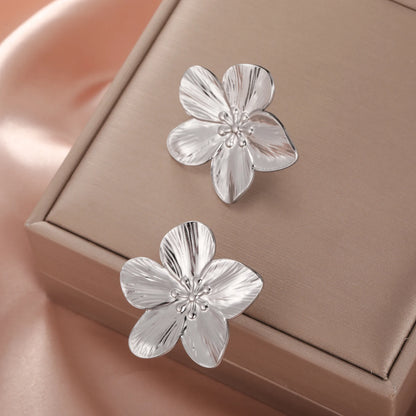 Boucles d’oreilles fleur dorée – acier inoxidable