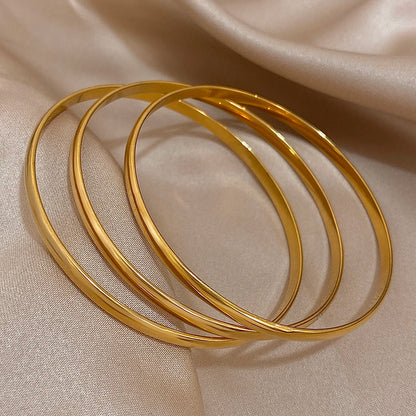 Lot de 3 bracelets joncs dorés
