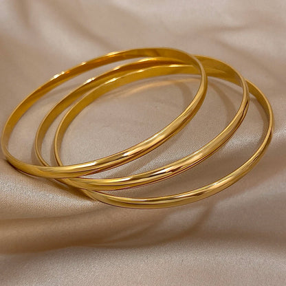 Lot de 3 bracelets joncs dorés