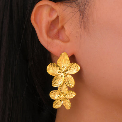 Boucles d’oreilles fleur dorée – acier inoxidable